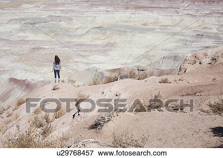 USA, Arizona, Painted Desert, Woman standing and looking at view View Large Photo Image Stock Photo - USA, Arizona, Painted Desert, Woman standing and looking at view. Fotosearch