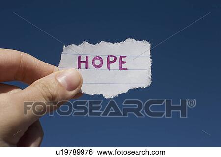 USA, Arizona, Winslow, Human hand holding paper with "hope" text on it View Large Photo Image Stock Photograph - USA, Arizona, Winslow, Human hand holding paper with "hope" text on it. Fotosearch