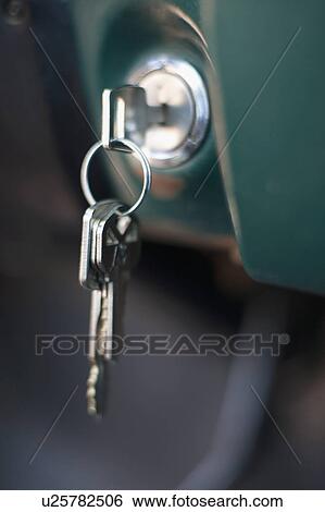 Stock Photograph - USA, Arizona, Winslow, Key in ignition, close-up. Fotosearch