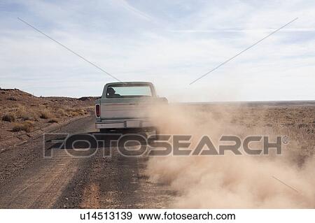 Stock Photo - USA, Arizona, Winslow, Pick-up truck driving. Fotosearch