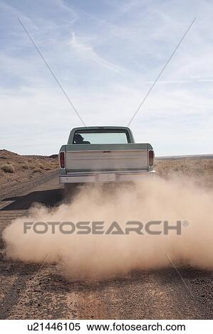 Stock Photography - USA, Arizona, Winslow, Pick-up truck driving. Fotosearch