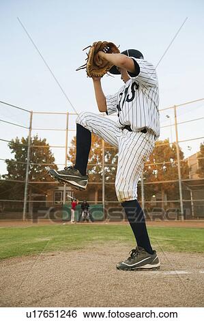 Stock Photograph - USA, California, Ladera Ranch, boy (10-11) playing baseball. Fotosearch