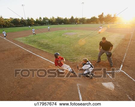 USA, California, Ladera Ranch, boys (10-11) playing baseball View Large Photo Image Picture - USA, California, Ladera Ranch, boys (10-11) playing baseball. Fotosearch