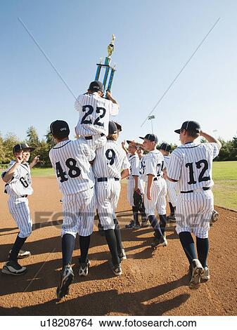 Picture - USA, California, Ladera Ranch, Boys (10-11) from Little league celebrating after winning. Fotosearch