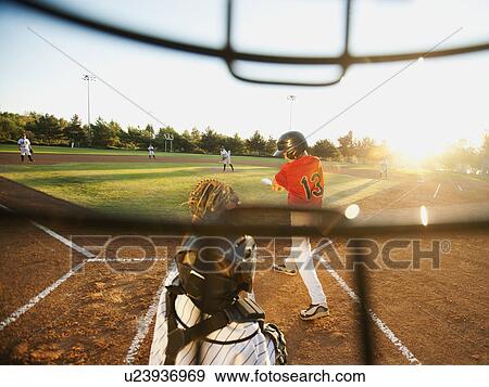 USA, California, Ladera Ranch, boys (10-11) playing baseball seen through helmet View Large Photo Image Stock Photo - USA, California, Ladera Ranch, boys (10-11) playing baseball seen through helmet. Fotosearch
