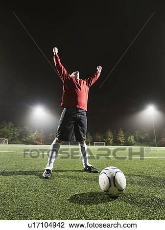 Stock Image - USA, California, Ladera Ranch, Football player preparing for penalty kick. Fotosearch