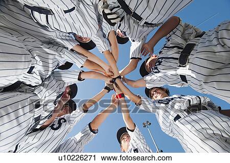 Stock Image - USA, California, Ladera Ranch, little league players (aged 10-11) celebrating. Fotosearch