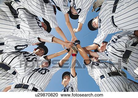Stock Image - USA, California, Ladera Ranch, little league players (aged 10-11) celebrating. Fotosearch