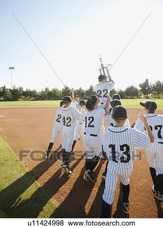 USA, California, Ladera Ranch, little league players (aged 10-11) celebrating View Large Photo Image Stock Photo - USA, California, Ladera Ranch, little league players (aged 10-11) celebrating. Fotosearch