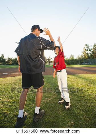 USA, California, Ladera Ranch, man and boy (10-11) on baseball field View Large Photo Image Stock Image - USA, California, Ladera Ranch, man and boy (10-11) on baseball field. Fotosearch