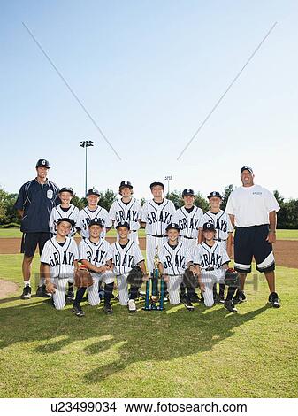 Picture - USA, California, Ladera Ranch, portrait of little league players (aged 10-11). Fotosearch