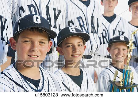 Stock Photo - USA, California, Ladera Ranch, portrait of little league players (aged 10-11). Fotosearch