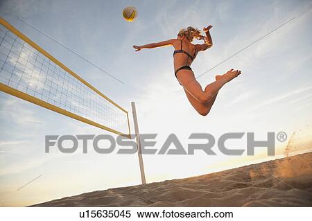USA, California, Los Angeles, woman playing beach volleyball View Large Photo Image Stock Photography - USA, California, Los Angeles, woman playing beach volleyball. Fotosearch