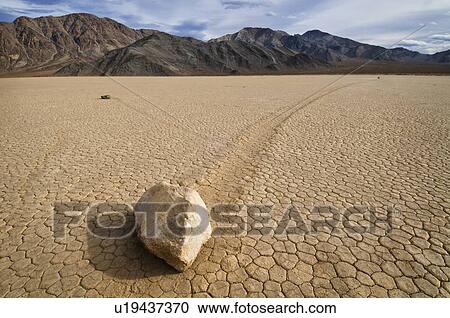Stock Image - USA, California, Moving rock in desert . Fotosearch
