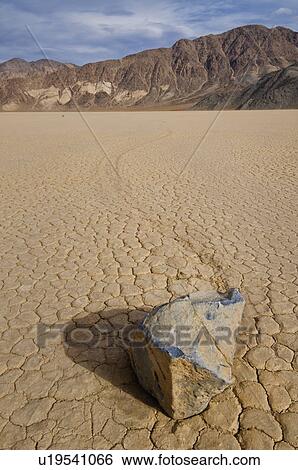 Stock Photograph - USA, California, Moving rock in desert . Fotosearch
