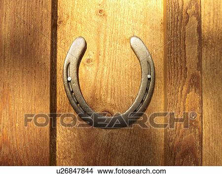 USA, Colorado, Horseshoe hanging on wooden wall, close-up View Large Photo Image Picture - USA, Colorado, Horseshoe hanging on wooden wall, close-up. Fotosearch