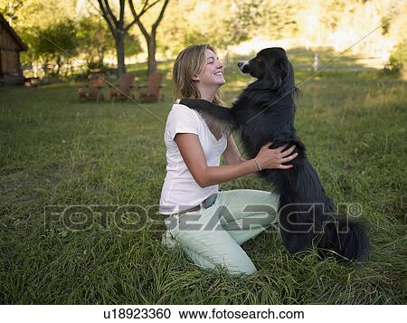 USA, Colorado, Young happy woman with her dog View Large Photo Image Stock Image - USA, Colorado, Young happy woman with her dog. Fotosearch