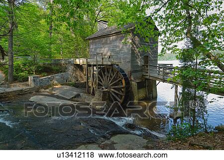 Stock Photo - USA, Georgia, Stone Mountain, Watermill in trees. Fotosearch