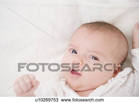 Stock Image - USA, New Jersey, Jersey City, Baby girl (2-5 months) portrait. Fotosearch
