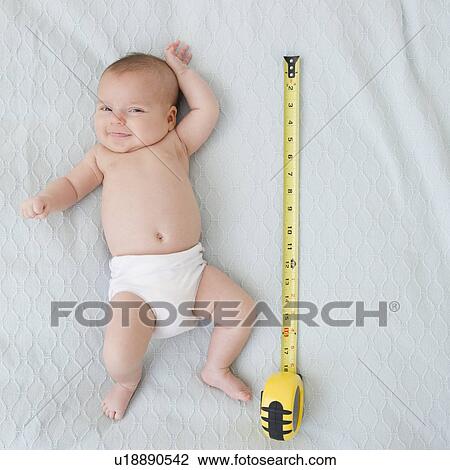 USA, New Jersey, Jersey City, baby girl laying (2-5 months) laying next to measuring tape View Large Photo Image Stock Image - USA, New Jersey, Jersey City, baby girl laying (2-5 months) laying next to measuring tape. Fotosearch