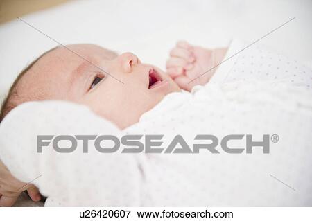 Stock Photo - USA, New Jersey, Jersey City, Baby girl (2-5 months) portrait. Fotosearch