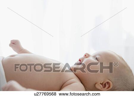 Stock Photo - USA, New Jersey, Jersey City, baby girl (2-5 months) portrait. Fotosearch