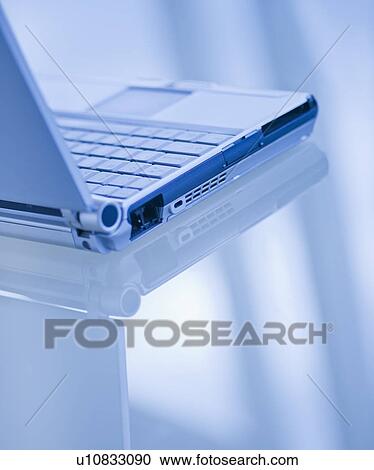 Stock Image - USA, New Jersey, Jersey City, Close-up view of open laptop. Fotosearch