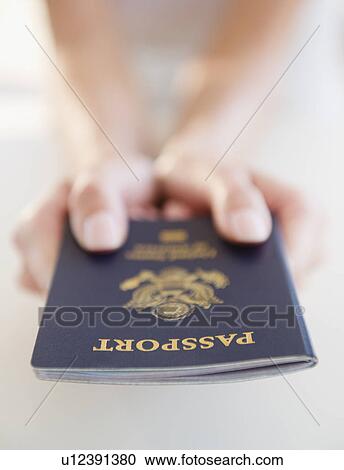 USA, New Jersey, Jersey City, Close-up view of woman's hands holding US passport View Large Photo Image Stock Image - USA, New Jersey, Jersey City, Close-up view of woman's hands holding US passport. Fotosearch