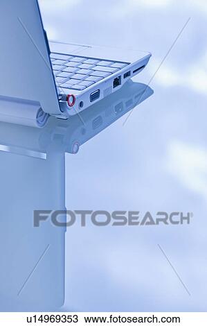 Stock Image - USA, New Jersey, Jersey City, Close-up view of open laptop. Fotosearch