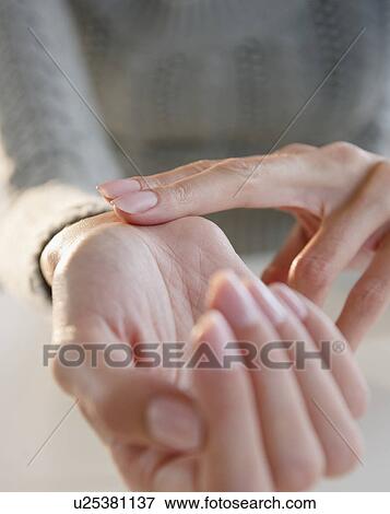 Stock Photo - USA, New Jersey, Jersey City, Close-up view of woman hands. Fotosearch