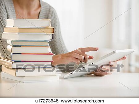 Stock Photograph - USA, New Jersey, Jersey City, Close-up view of woman using palmtop. Fotosearch