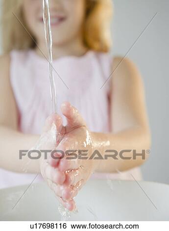 USA, New Jersey, Jersey City, Close-up view of girl (8-9) washing hands View Large Photo Image Stock Photograph - USA, New Jersey, Jersey City, Close-up view of girl (8-9) washing hands. Fotosearch