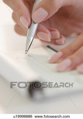 USA, New Jersey, Jersey City, Close-up view of woman's hand writing with pen View Large Photo Image Stock Photograph - USA, New Jersey, Jersey City, Close-up view of woman's hand writing with pen. Fotosearch