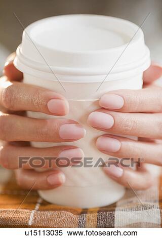 USA, New Jersey, Jersey City, Close-up view of woman's hands holding takeaway coffee View Large Photo Image Stock Photography - USA, New Jersey, Jersey City, Close-up view of woman's hands holding takeaway coffee. Fotosearch