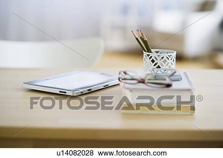 USA, New Jersey, Jersey City, Digital tablet and stationery on desk View Large Photo Image Stock Photo - USA, New Jersey, Jersey City, Digital tablet and stationery on desk. Fotosearch