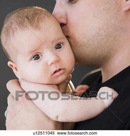 USA, New Jersey, Jersey City, Father kissing baby daughter (2-5 months) View Large Photo Image Stock Photography - USA, New Jersey, Jersey City, Father kissing baby daughter (2-5 months). Fotosearch