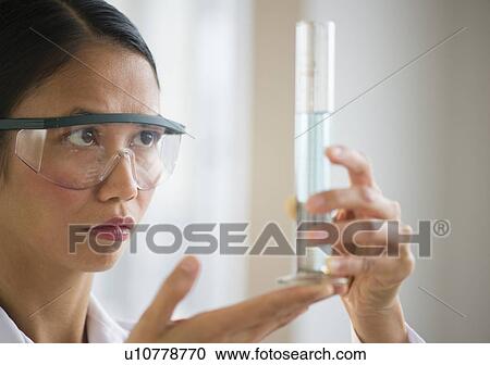 USA, New Jersey, Jersey City, Female scientist holding chemical test tube View Large Photo Image Stock Image - USA, New Jersey, Jersey City, Female scientist holding chemical test tube. Fotosearch