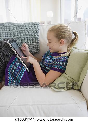 Picture - USA, New Jersey, Jersey City, Girl (8-9) using palmtop. Fotosearch