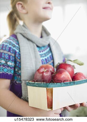 USA, New Jersey, Jersey City, Girl (8-9) holding box of apples View Large Photo Image Stock Image - USA, New Jersey, Jersey City, Girl (8-9) holding box of apples. Fotosearch