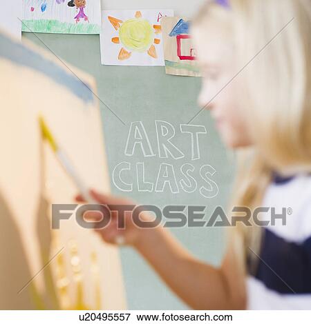 Stock Photo - USA, New Jersey, Jersey City, Girl (8-9) painting. Fotosearch