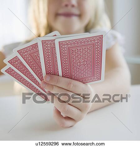 USA, New Jersey, Jersey City, Girl (8-9) playing cards View Large Photo Image Stock Photograph - USA, New Jersey, Jersey City, Girl (8-9) playing cards. Fotosearch