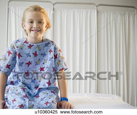 USA, New Jersey, Jersey City, Girl (8-9) sitting on hospital bed View Large Photo Image Stock Photography - USA, New Jersey, Jersey City, Girl (8-9) sitting on hospital bed. Fotosearch