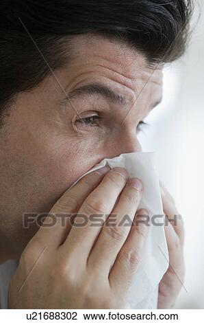 USA, New Jersey, Jersey City, Man with flu, blowing nose View Large Photo Image Stock Image - USA, New Jersey, Jersey City, Man with flu, blowing nose. Fotosearch