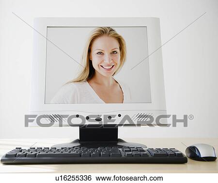 USA, New Jersey, Jersey City, PC flat screen showing attractive young woman View Large Photo Image Stock Photograph - USA, New Jersey, Jersey City, PC flat screen showing attractive young woman. Fotosearch