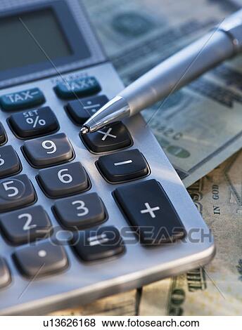 USA, New Jersey, Jersey City, Pen, calculator and dollar notes View Large Photo Image Stock Photo - USA, New Jersey, Jersey City, Pen, calculator and dollar notes. Fotosearch