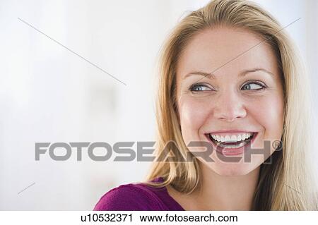 Stock Image - USA, New Jersey, Jersey City, Portrait of young attractive woman. Fotosearch