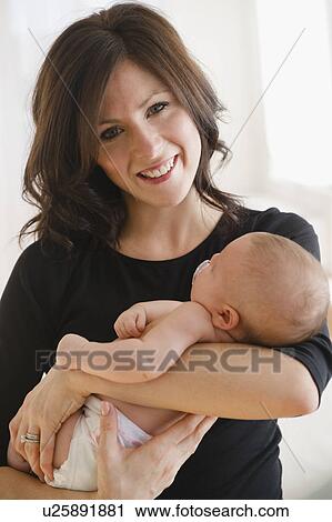 USA, New Jersey, Jersey City, Portrait of mother with baby daughter (2-5 months) View Large Photo Image Stock Image - USA, New Jersey, Jersey City, Portrait of mother with baby daughter (2-5 months). Fotosearch