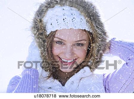 USA, New Jersey, Jersey City, Portrait of young woman wearing white knitted hat View Large Photo Image Stock Photo - USA, New Jersey, Jersey City, Portrait of young woman wearing white knitted hat. Fotosearch