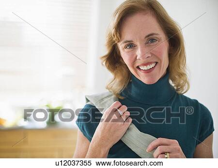 USA, New Jersey, Jersey City, Portrait of woman in kitchen View Large Photo Image Stock Photography - USA, New Jersey, Jersey City, Portrait of woman in kitchen. Fotosearch