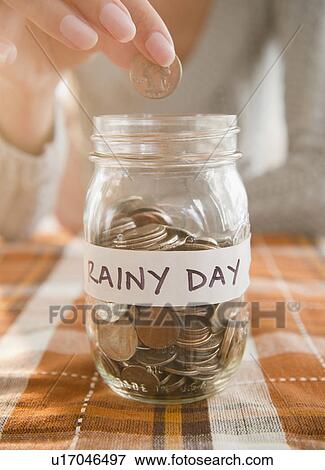 USA, New Jersey, Jersey City, Saving up for rainy day View Large Photo Image Stock Photo - USA, New Jersey, Jersey City, Saving up for rainy day. Fotosearch